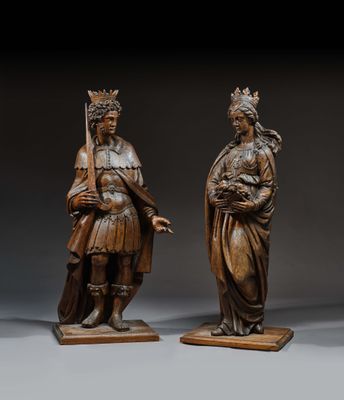 pair of carved wood figures of a woman and a man