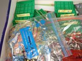 a box of assorted legos and other toys in it