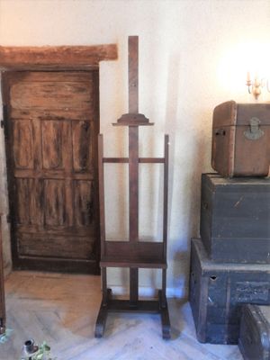 many suitcases and boxes in a room with a wooden door