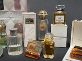 many different types of perfume bottles on a table