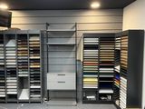 a large room with a lot of shelves and a tv