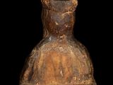 wooden statue of a man with a hat on a black background