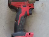 an image of a cordless drill on a concrete floor