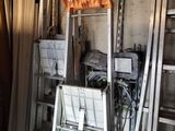 several ladders are stacked on top of each other in a room