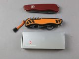 a swiss army knife and a swiss army knife on a table