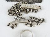 a purse, ring, and other items that are on a table
