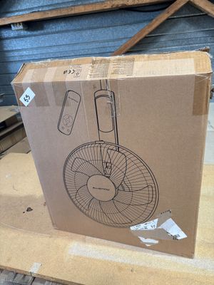 cardboard box with a drawing of a fan on it sitting on a table