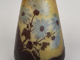 a vase that has a flower design on it
