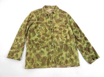 a camouflage jacket on a white background with a white background