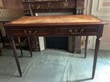 a desk with a drawer on it in a room