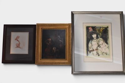 three framed pictures on the wall of a room