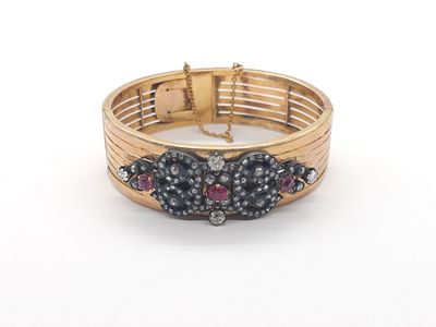 an image of a close up of a bracelet on a white surface