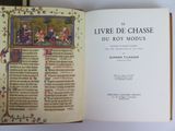 an open book with a picture of people on it