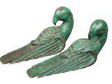 pair of green metal bird bookends on a white background