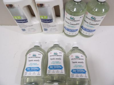 several bottles of hand sanitizer sitting on top of a counter