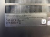 a close up of the back of a laptop with a sticker on it