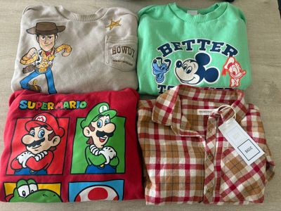 three shirts that are sitting on a table together