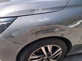 a close up of a car ' s front wheel and tire