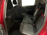 a red car with black seats in the back of it