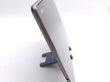 a close up of a tablet computer on a stand