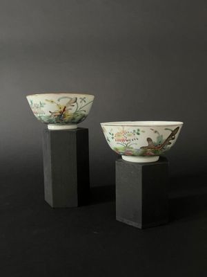 pair of chinese porcelain bowls on pedestals with birds and flowers