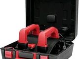 two red and black tools in a black case