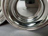 a silver plate that has a camera on top of it