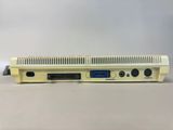 a close up of a small computer on a white surface