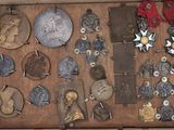 a wooden box filled with different types of medals