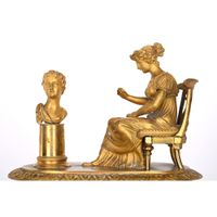 PENDULE EMPIRE en bronze doré représentant une femme à l’ant… (photo 2)