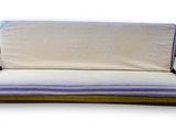 a couch that has a mattress on top of it