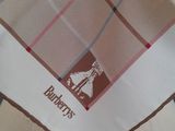 a brown and white checkered handkerchief with a horse on it