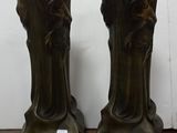 two vases that are sitting on a wooden table