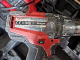 an image of a cordless drill with a battery attached to it