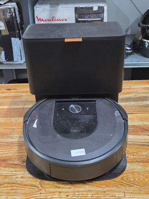 a robot that is sitting on top of a wooden table