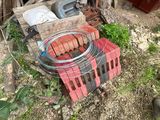 a fire pit with a bunch of hot dogs cooking on it