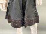 an image of a mannequin wearing a dress and jacket