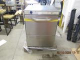 an image of a commercial dishwasher in a warehouse