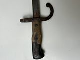 a knife hanging on a hook on a wall
