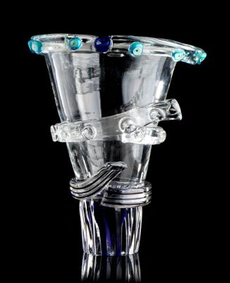 a clear glass vase with a blue handle on a black background