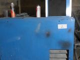 a blue machine that is sitting in a room