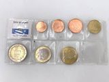 a close up of a bunch of coins in a plastic bag