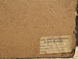 a brown box with a label on it sitting on the ground