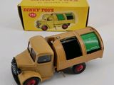 a toy truck that is sitting in front of a box