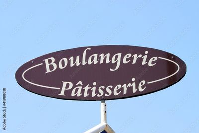 a sign that says boulangerie patisserie on it
