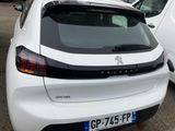 a white car parked in a parking lot with other cars in the background