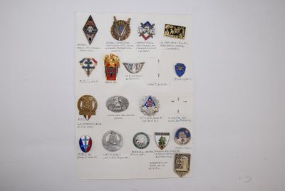 a lot of badges on a piece of paper on the wall
