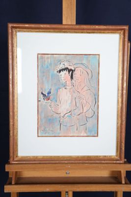 un tableau représentant une femme tenant un oiseau, posé sur un chevalet