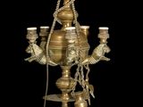 an image of a gold colored lamp with a bird on it