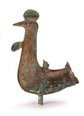 a bronze statue of a bird with a crown on it ' s head
